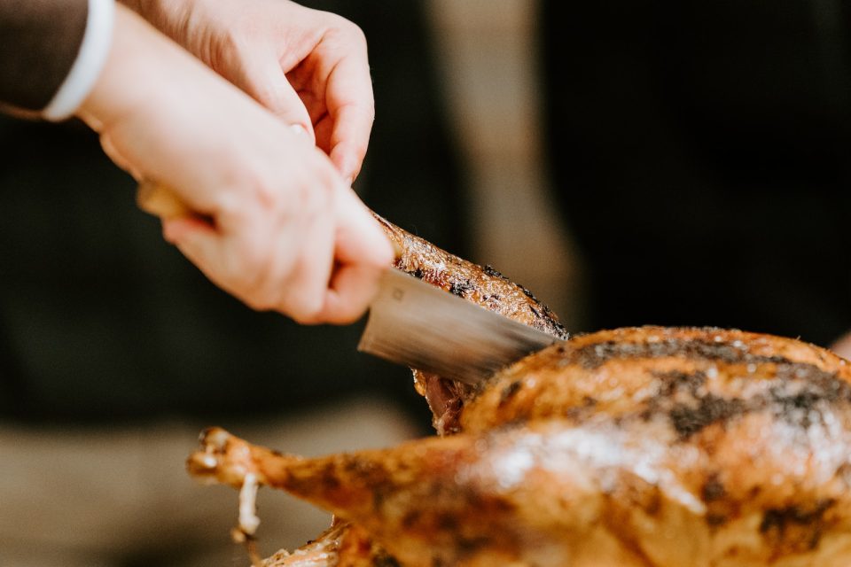 person holding a brown meat