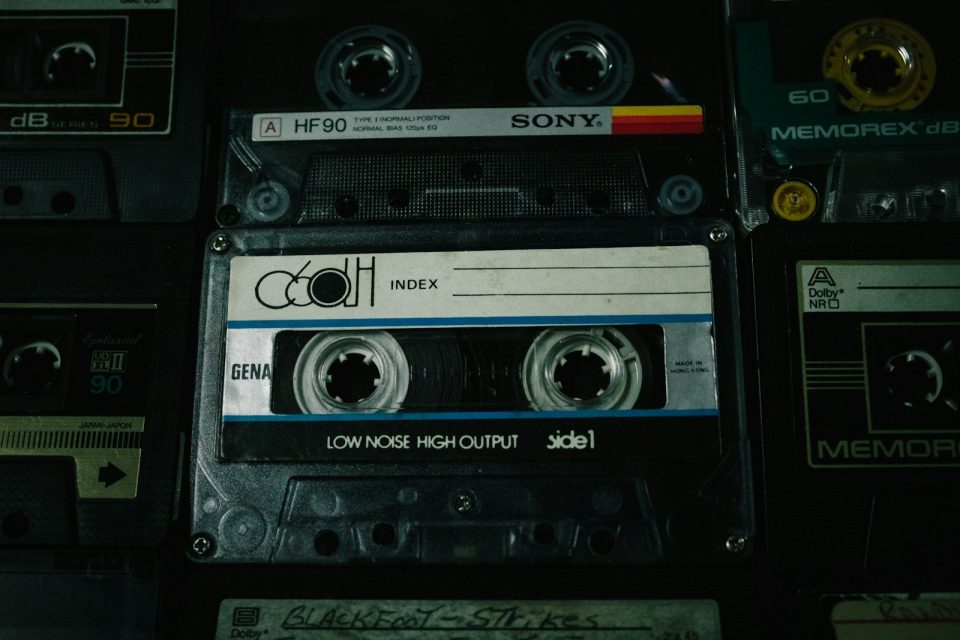 a pile of old cassettes sitting on top of each other